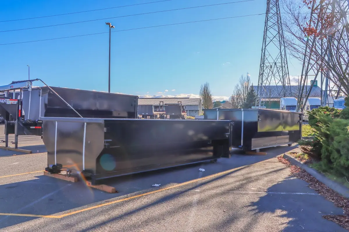 Roll-off dumpster ready for waste disposal at job site for 15 Yard Dumpster Rental in Alpine